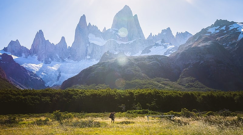 Woman hiking under Fitz Roy in Los Glaciares National Park in Patagonia, Argentina