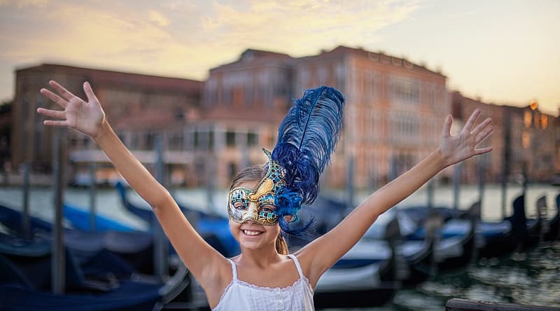 Young girl wearing carnival mask in Venice, Italy