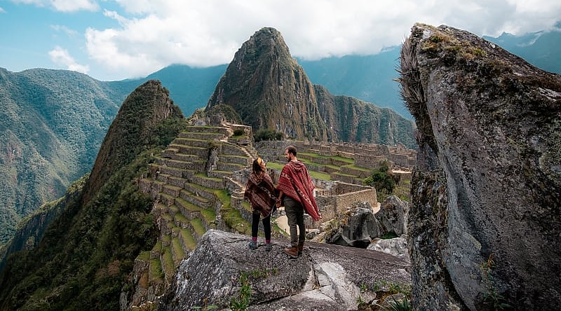 Couple at the great Inca city of Machu Picchu in Peru