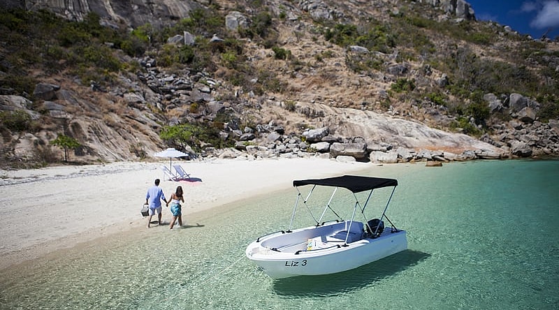 Couple on secluded beach on Lizard Island, Australia