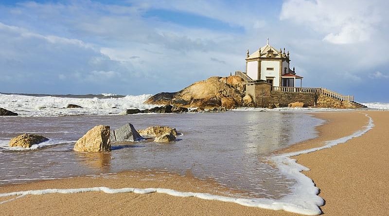 Capela do Senhor da Pedra, a small church on the shore, Porto, Portugal