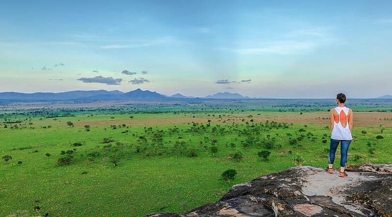 Woman admiring the landscape of Kidepo Valley National Park, Uganda