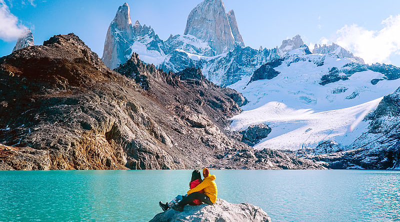 Couple admiring mount Fitzroy in the Argentinian Patagonia