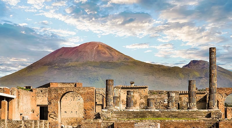 Ancient Roman city of Pompeii and Vesuvius in the background