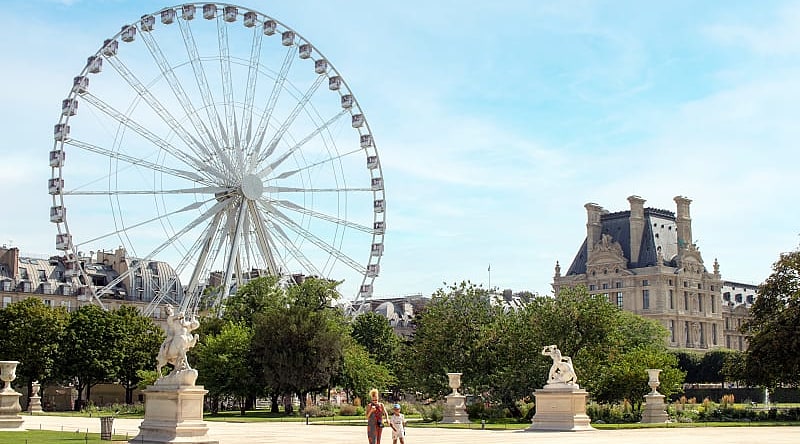 Mother and daughter walk in Paris Tuileries Garden, France