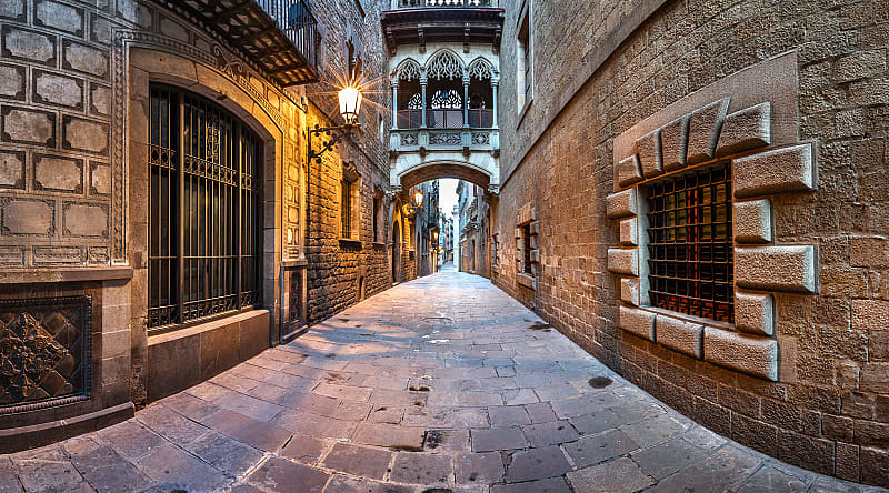 Street lights illuminate balconies in the Gothic Quarter, Barcelona, Spain