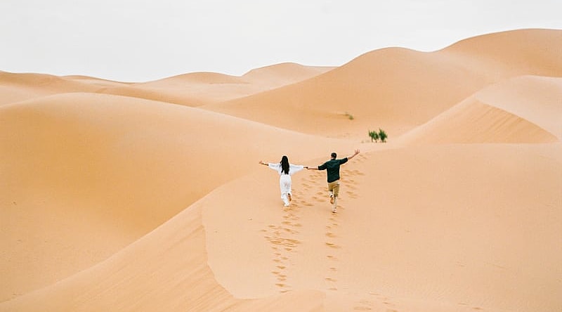 Couple at the Sahara desert in Morocco