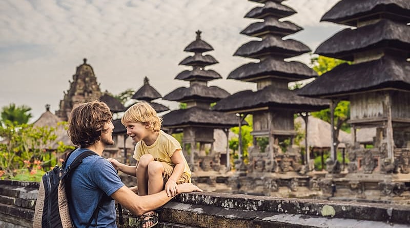 Dad and son tourists in traditional Balinese hindu temple