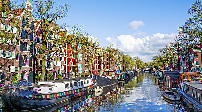 Dutch buildings and canal in Amsterdam, Netherlands