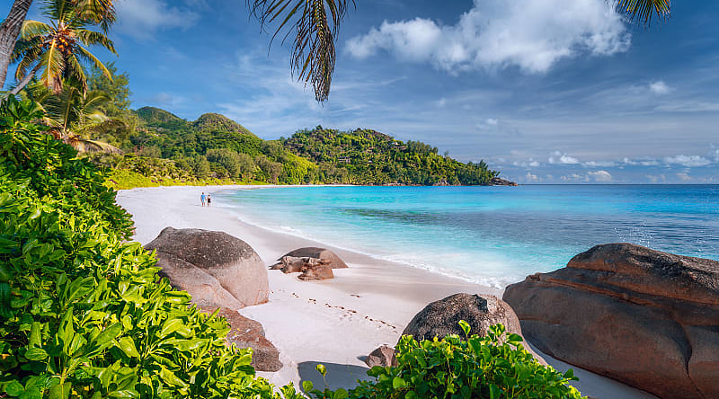 Couple on beautiful Anse Intendance beach on Mahe island, Seychelles