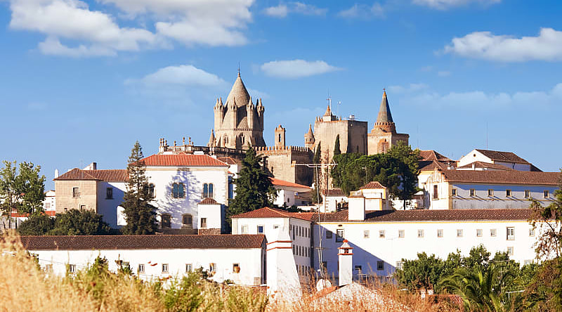 Washed buildings surrounding the Cathedral in Evora, Portugal