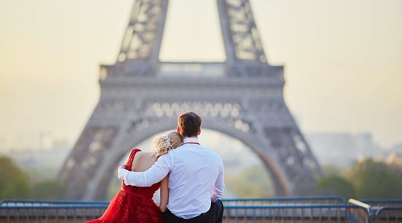 Couple overlooking the Eiffel Tower in Paris, France