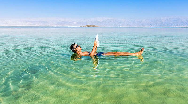 Tourist floating on the Dead Sea in Israel