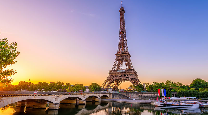 A river cruise on the Seine passing by the Eiffel Tower.