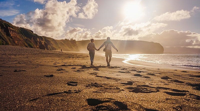 Couple walking on the beach in Sao Miguel, Azores, Portgal