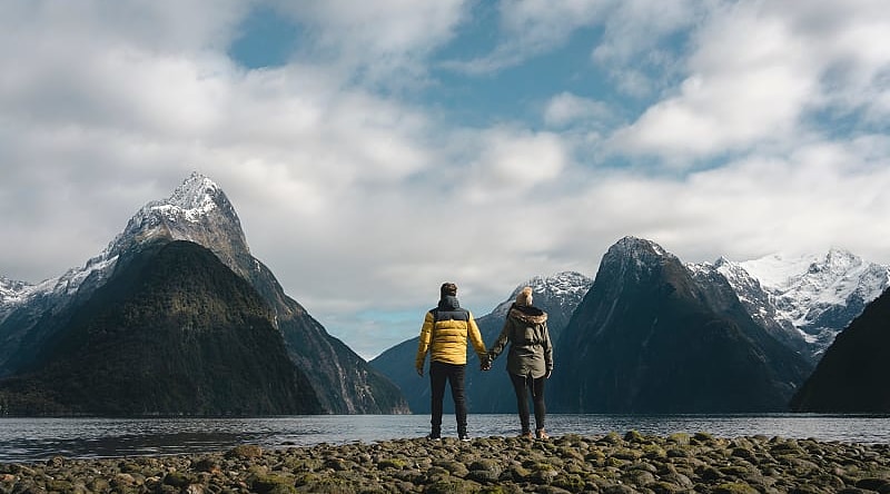 Couple at Milford Sound in New Zealand