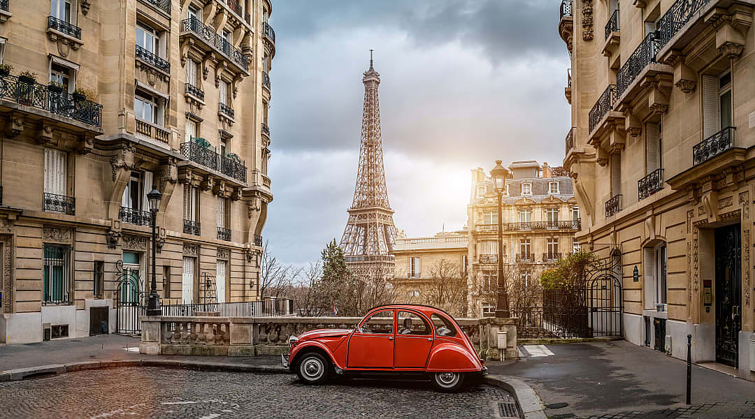 Small Paris street with view of the famous Eiffel Tower