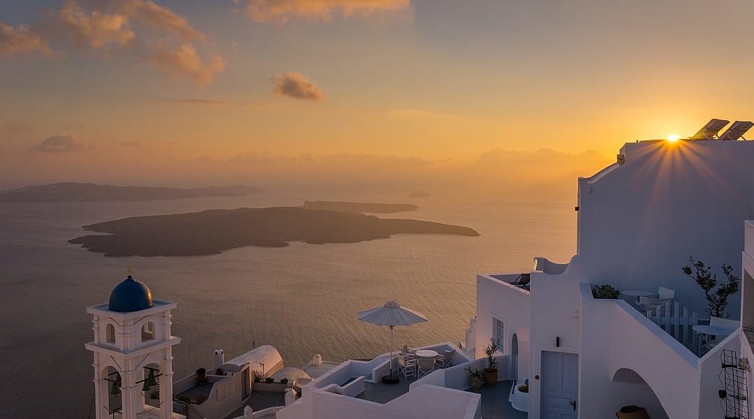 Sunset over Santorini’s whitewashed paradise.