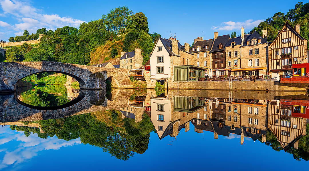 The old stone bridge and medieval houses in Port Dinan town, France