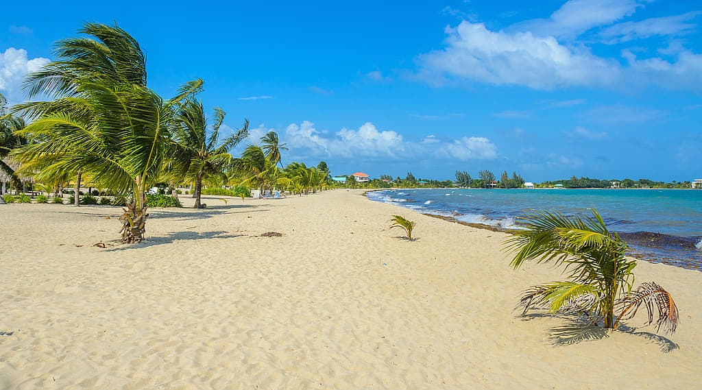Long stretch of pristine beach in Placencia, Belize