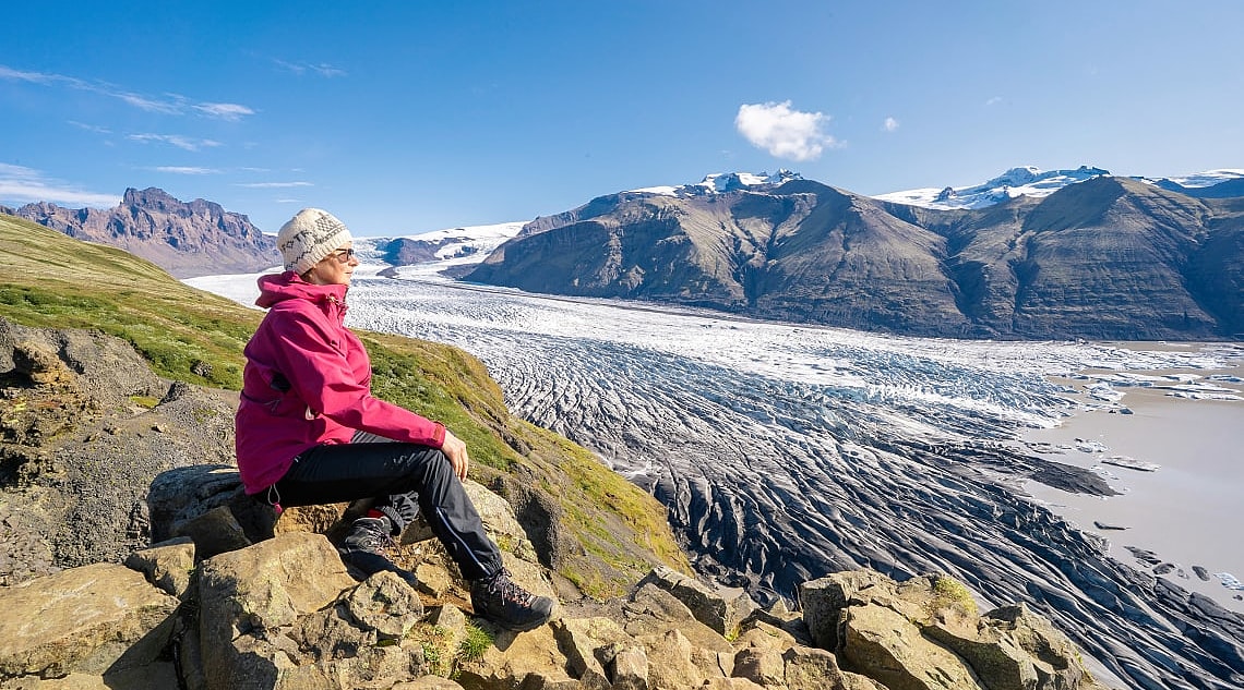 Senior woman overlooking Vatnajokull Glacier in Iceland