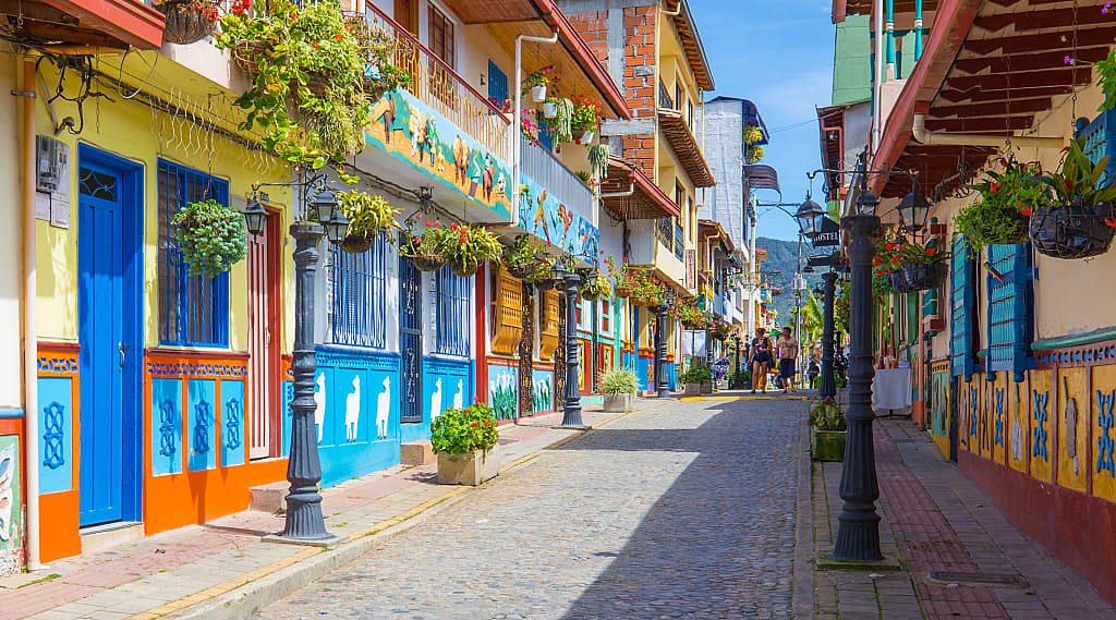 Cobblestone street with colorful buildings in Guatape, Colombia