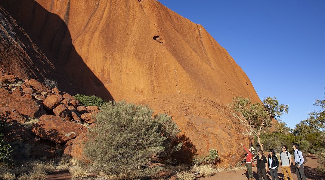 Family on private tour at Uluru in the Northern Territory, Australia