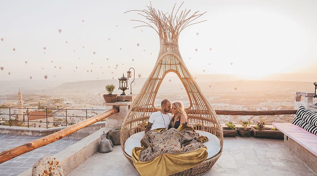 Couple in Cappadocia enjoying the sunrise in Turkey