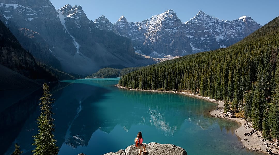Woman hiking at Moraine Lake in Banff National Park, Canada