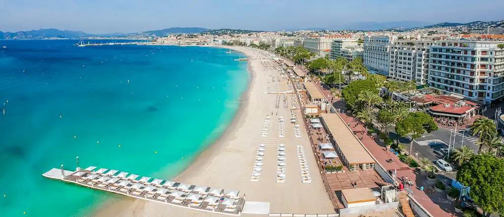 Cannes waterfront in Cannes, France Aerial view of Cannes coastline, beaches and marina along the French Riviera