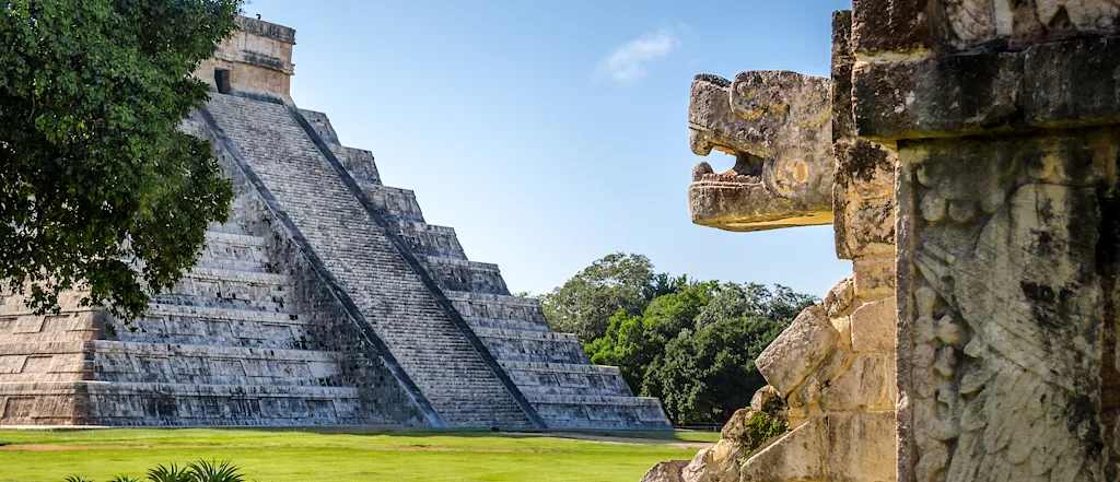 Jaguar head and pyramid of Kukulkan - Chichen Itza, Mexico