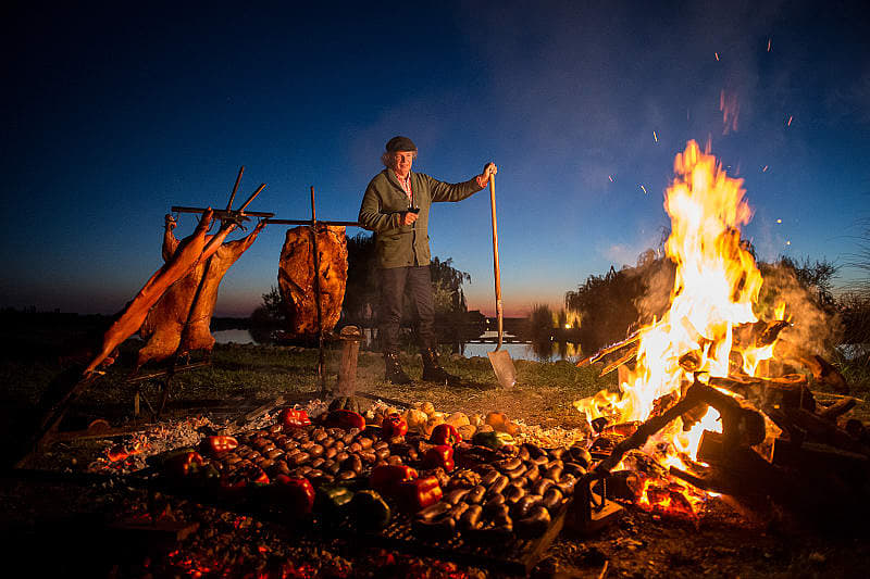 Chef Francis Mallmann tends the fires at Siete Fuegos restaurant in Mendoza, Argentina Chef Francis Mallmann tends the fires at Siete Fuegos restaurant in Mendoza, Argentina