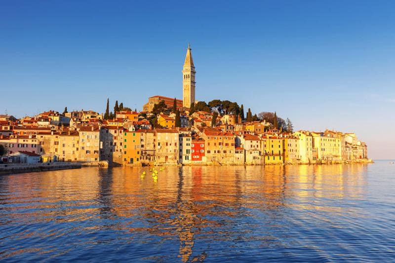 Seniors Trip to Croatia - Rovinj Seafront town of Rovinj with houses and church tower