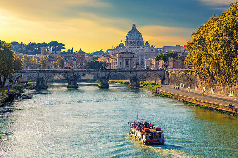 View of the Tiber and St. Peter's Basilica at sunset, Rome, Italy