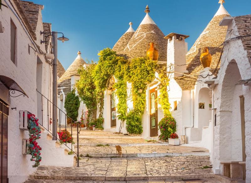 Traditional houses (trulli) in a quiet village in Puglia, Italy Traditional houses (trulli) in a quiet village in Puglia, Italy