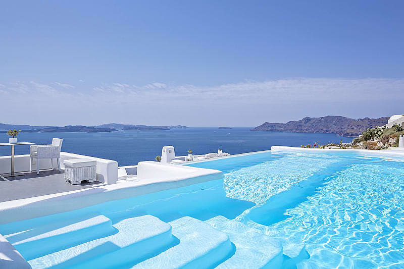 Luxury pool at Canaves Oia Boutique Hotel. Photo by Christos Drazos / courtesy of Canaves Oia Luxury pool at Canaves Oia Boutique Hotel in Santorini, Greece