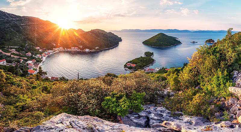 Luxury Island Hopping Vacation in Croatia - Mljet Sunset behind Prozurska Luka on the island Mljet in Croatia