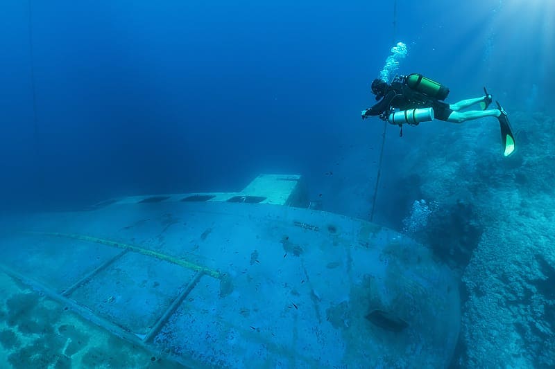 A scuba diver explores a sunken wreck in the Aegean Sea in Greece.