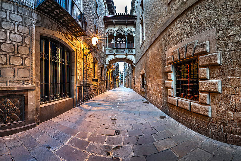 Street lights illuminate balconies in the Gothic Quarter, Barcelona, Spain