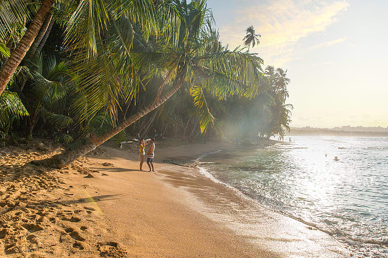 Couple at paradise beach of Manzanillo Park in Costa Rica