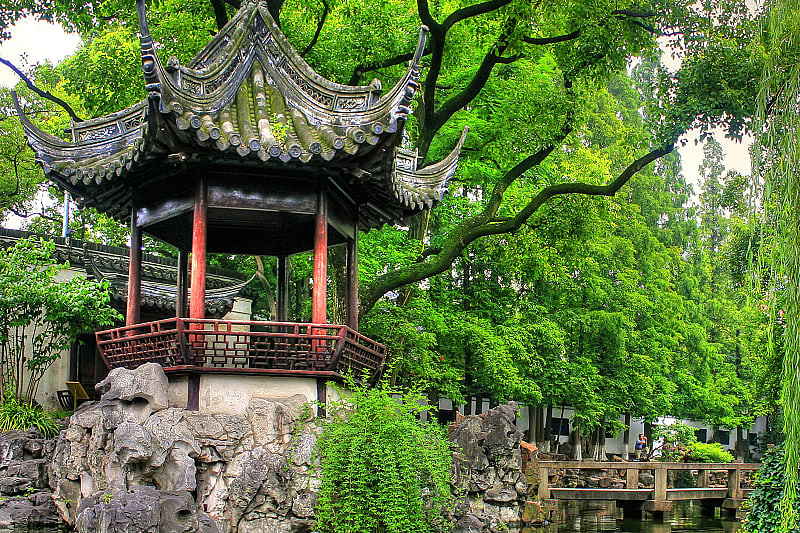 Meditate in the heart of Shanghai Yu Yuan Gardens, along the calm waters and winding forest paths.
