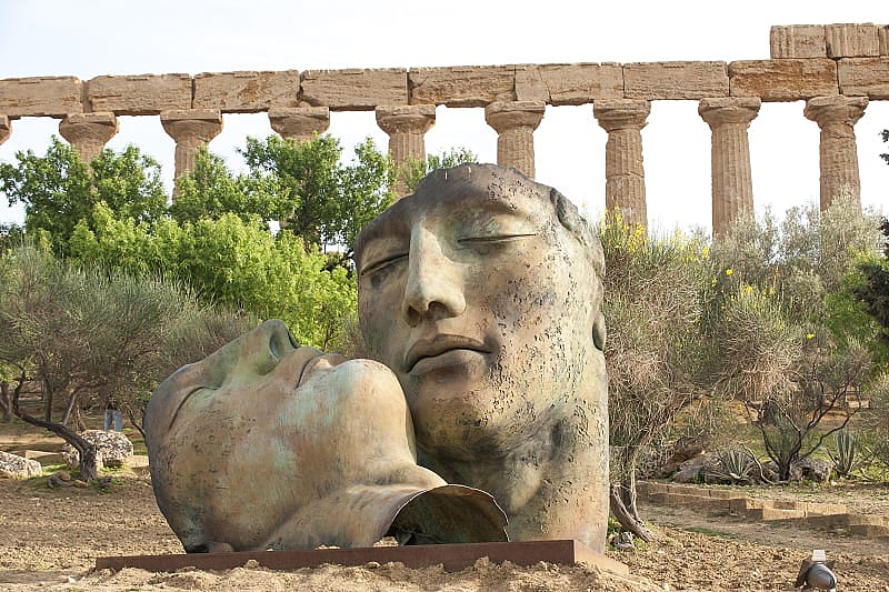 Sculptures by modern masters against the background of the ancient Temple of Juno, Valley of the Temples, Agrigento