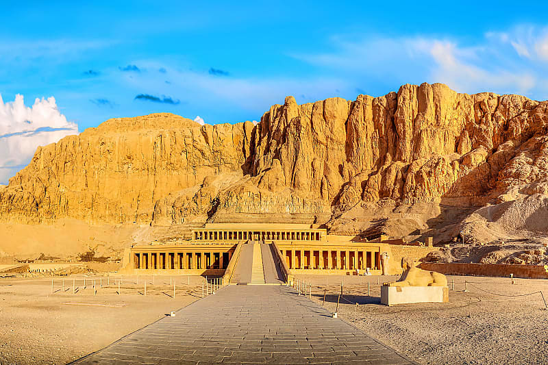 Famous History of Egypt Tour Temple of Queen Hatshepsut beneath the cliffs at Deir el-Bahari in Egypt.