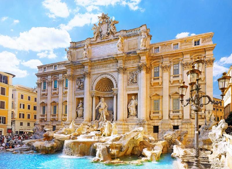 Trevi Fountain in Rome, Italy on a beautiful day with blue skies