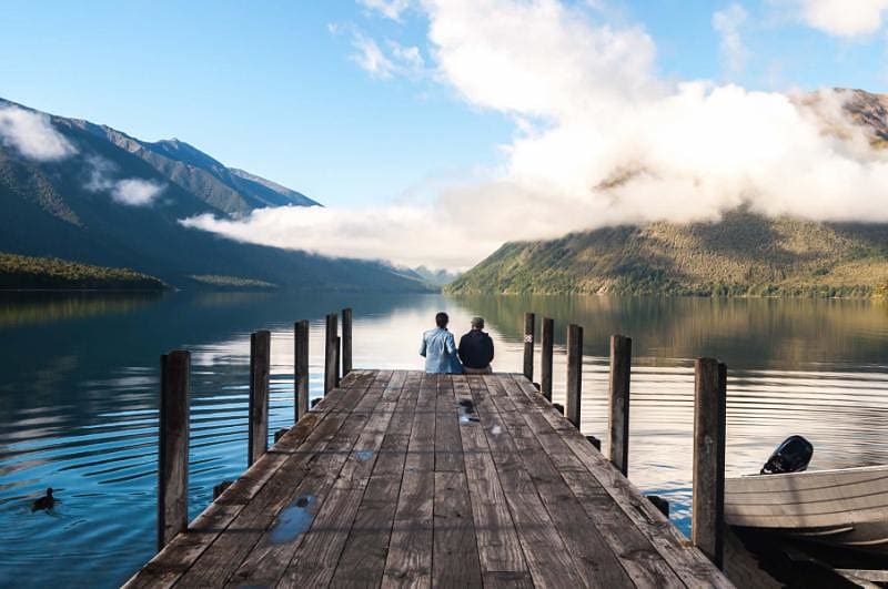 Couple sitting on the pier at Nelson Lake National Park