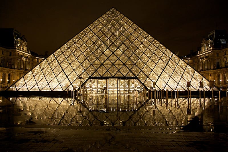Illuminated entrance to the Louvre in Paris.