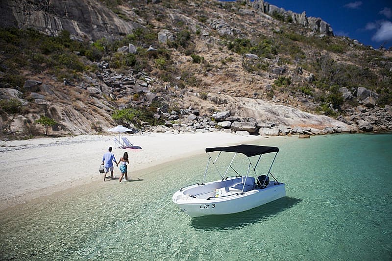 Couple on secluded beach on Lizard Island, Australia