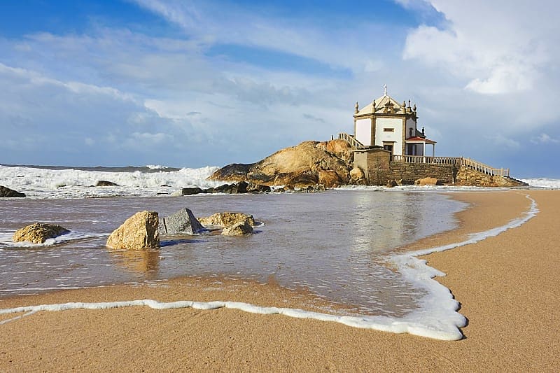 Capela do Senhor da Pedra, a small church on the shore, Porto, Portugal