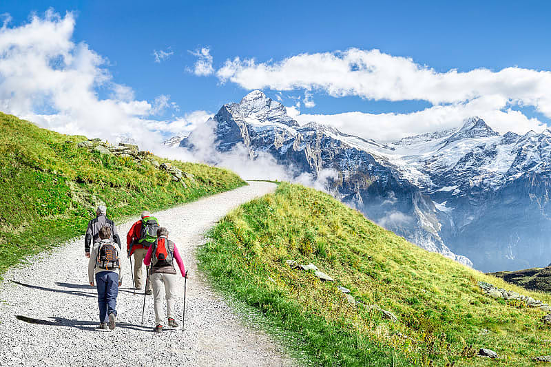 Family hiking in the Swiss Alps