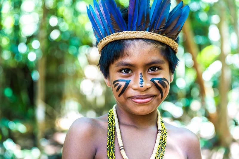 Native brazilian boy from an indigenous tribe in the Amazon
